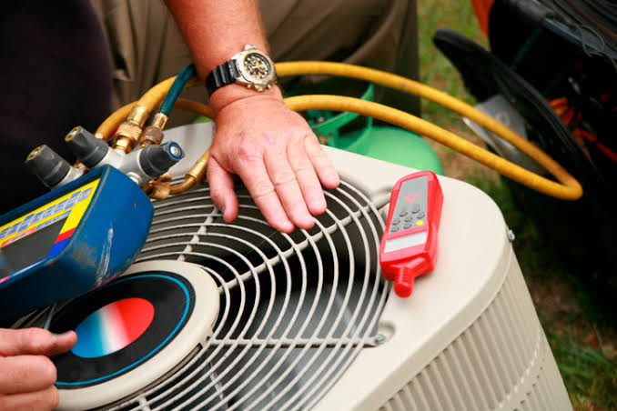 A Wespac technician commissioning a condensing unit on site
